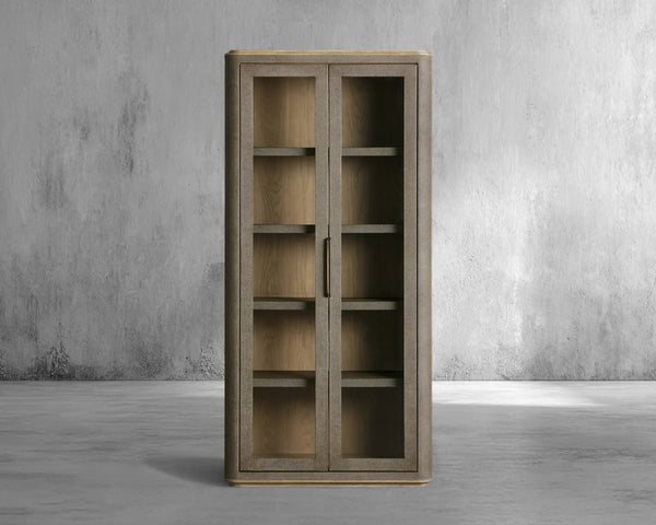 Wooden cabinet with glass doors against a gray concrete wall.