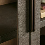 Close-up of a textured metallic surface with a handle