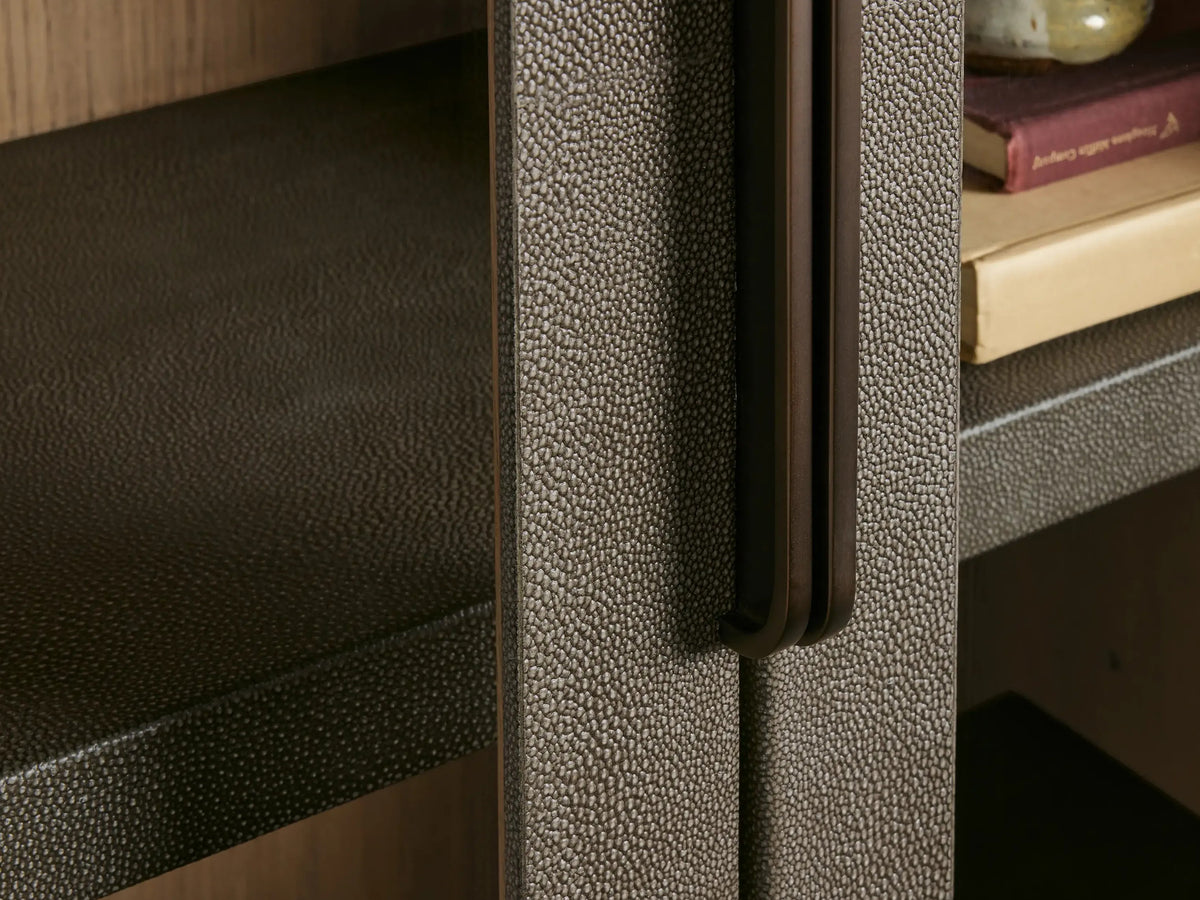 Close-up of a textured metallic surface with a handle