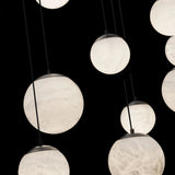 Chandelier with multiple round light bulbs against a black background